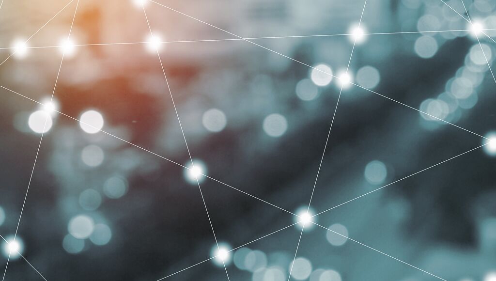 Abstractly depicted interconnected network, colored with shades of blue and orange.